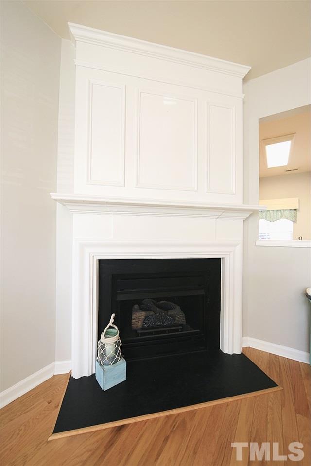 5013 Echo Ridge Road Raleigh, NC 27612 - Photo 4 of 15 a living room with furniture and a fireplace