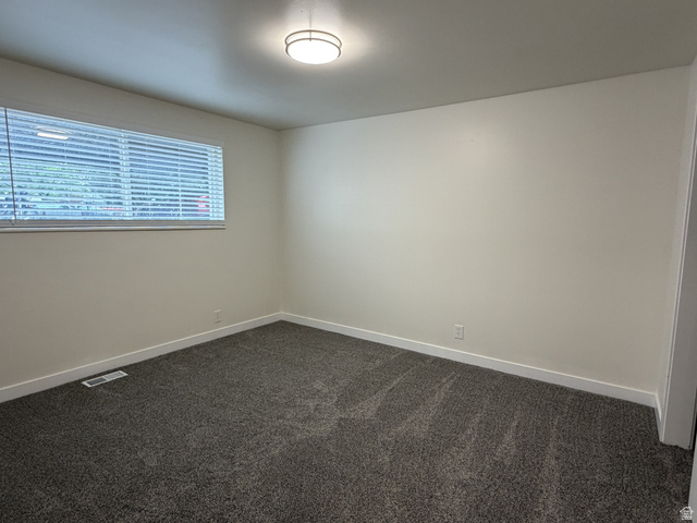 895 East Arrowhead Lane Murray, UT 84107 - Photo 6 of 12 Room featuring fresh carpet, neutral wall paint, white trim, and a window with blinds