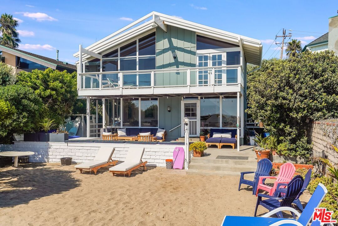30800 Broad Beach Road Malibu, CA 90265 - Photo 1 of 27 a view of a house with outdoor seating area and garden