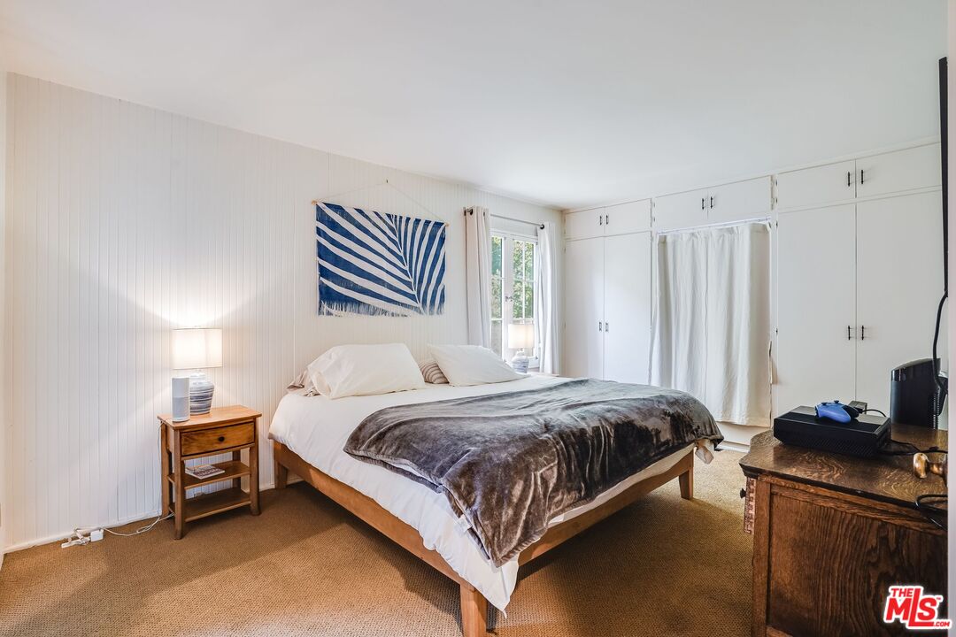 30800 Broad Beach Road Malibu, CA 90265 - Photo 21 of 27 a bedroom with a bed and a television