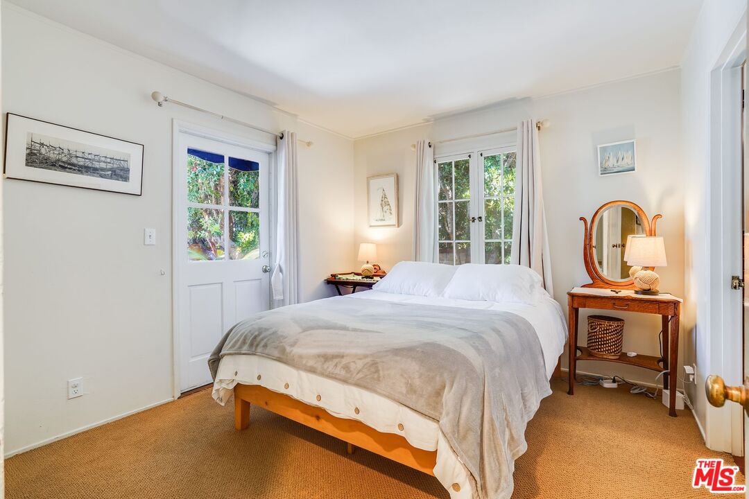 30800 Broad Beach Road Malibu, CA 90265 - Photo 23 of 27 a bed sitting in a bedroom next to a window