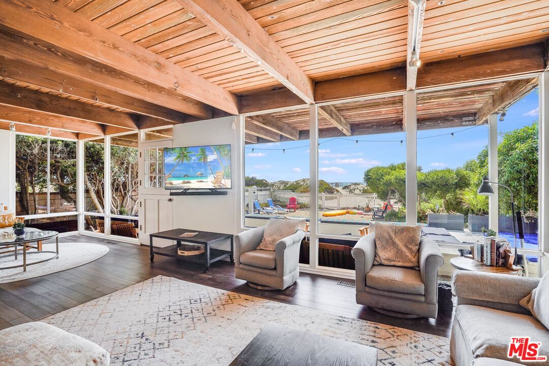 30800 Broad Beach Road Malibu, CA 90265 - Photo 8 of 27 a living room with patio furniture and a potted plants