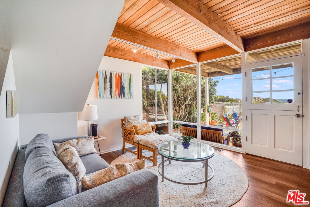 30800 Broad Beach Road Malibu, CA 90265 - Photo 9 of 27 a living room with furniture and a large window