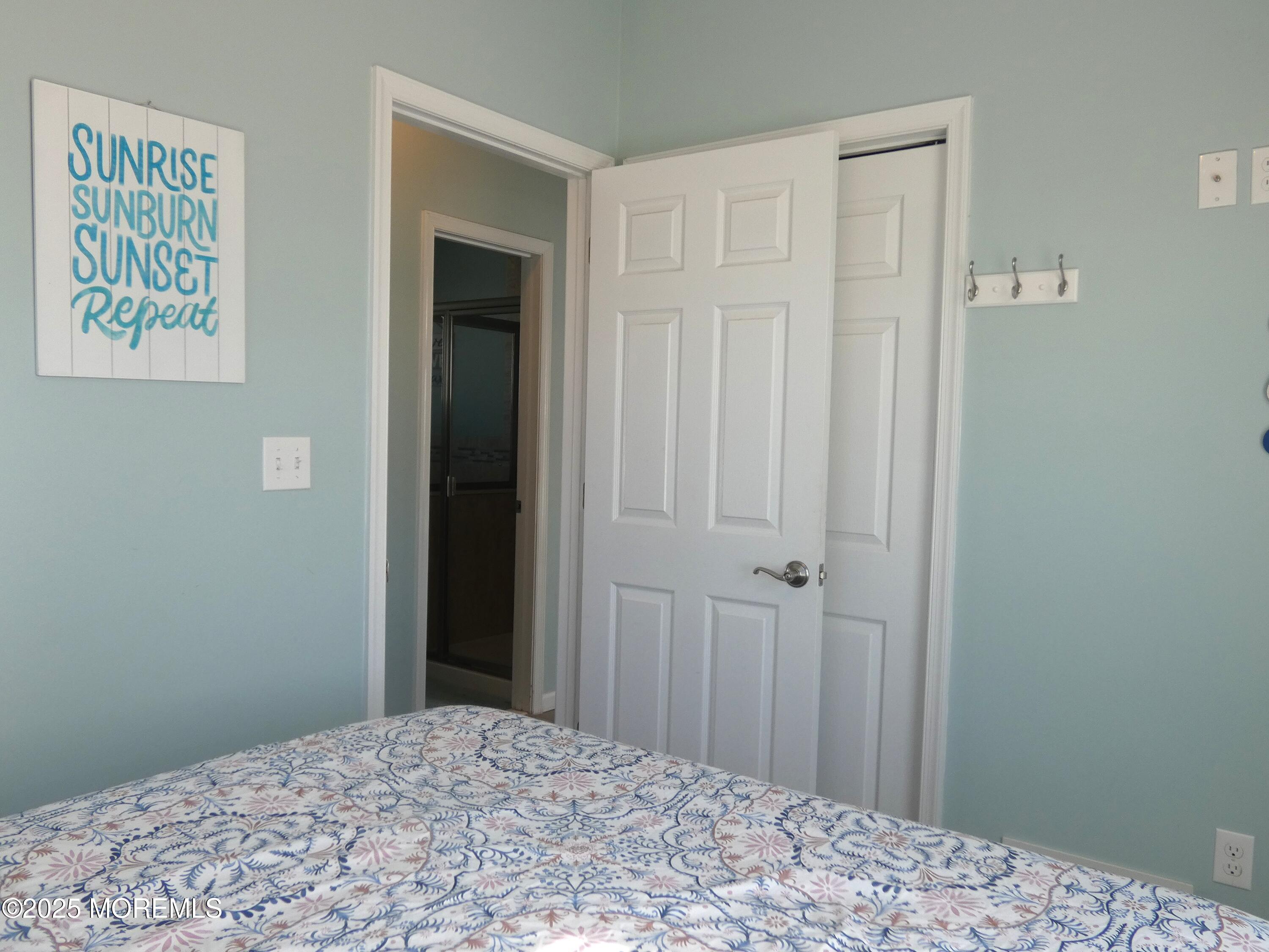 3311 Seaview Road Lavallette, NJ 08735 - Photo 11 of 27 a bedroom with a bed and a window