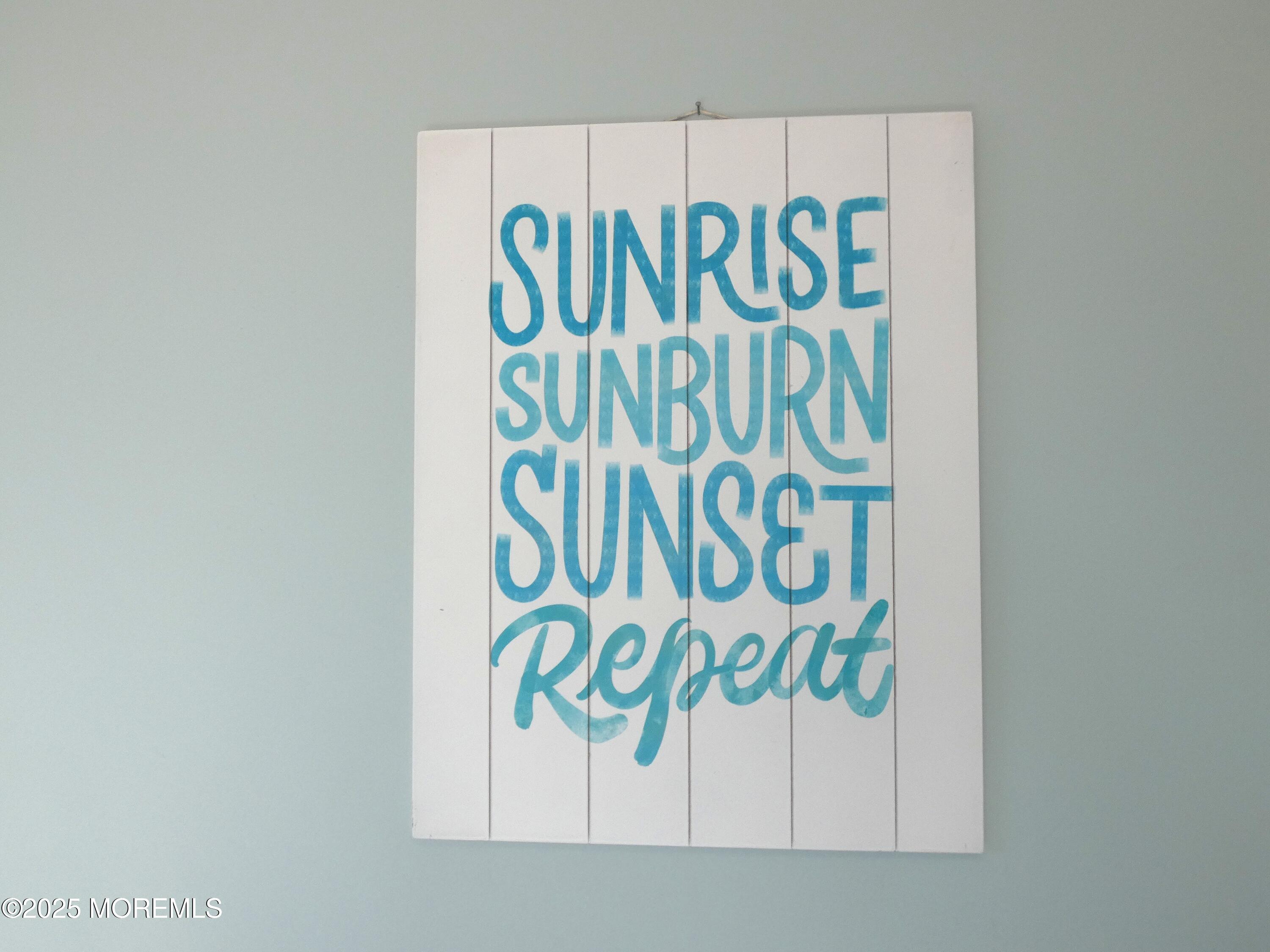 3311 Seaview Road Lavallette, NJ 08735 - Photo 12 of 27 a white wall with a white and with sign on it