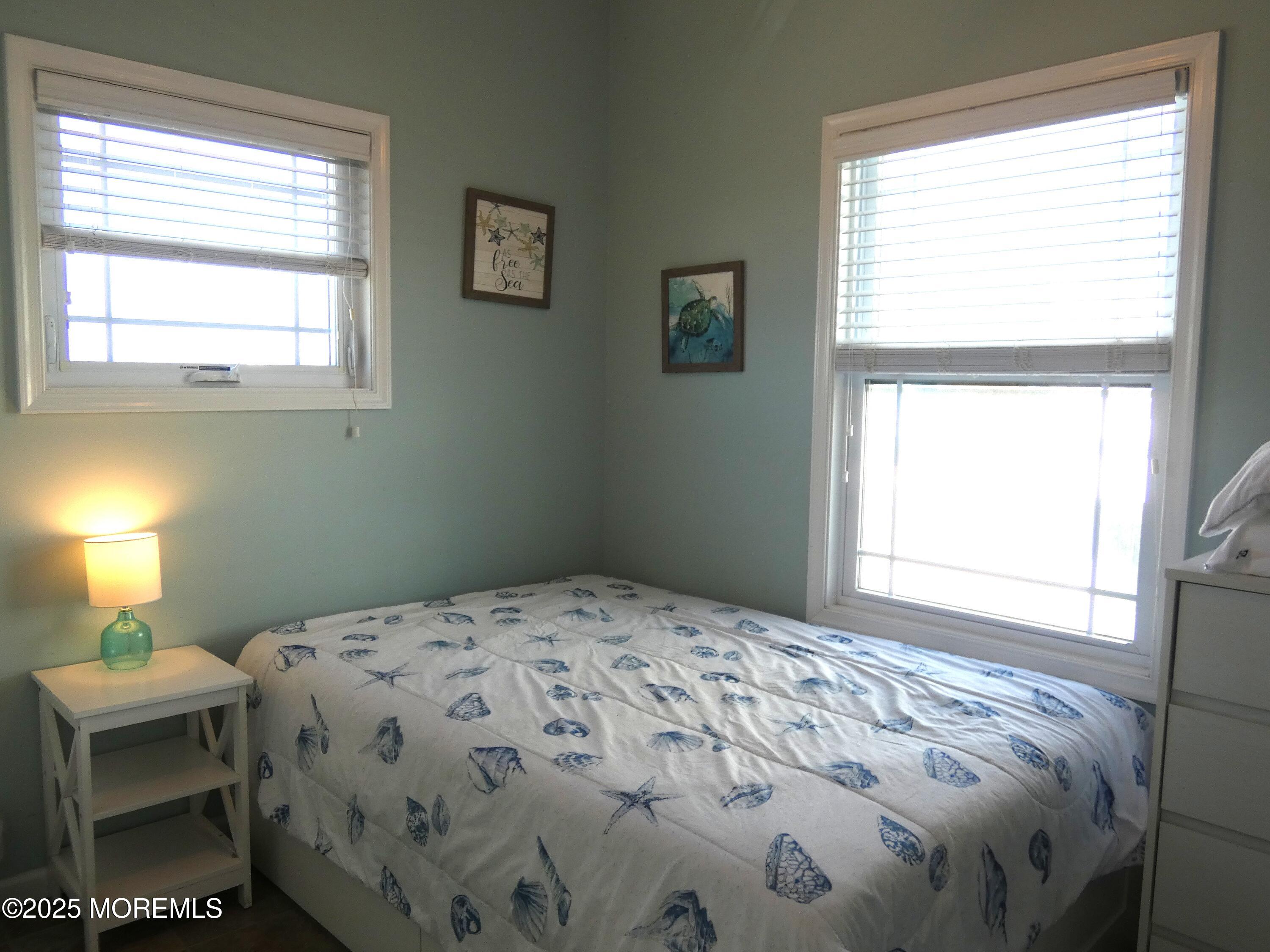 3311 Seaview Road Lavallette, NJ 08735 - Photo 13 of 27 a bedroom with a bed and a window