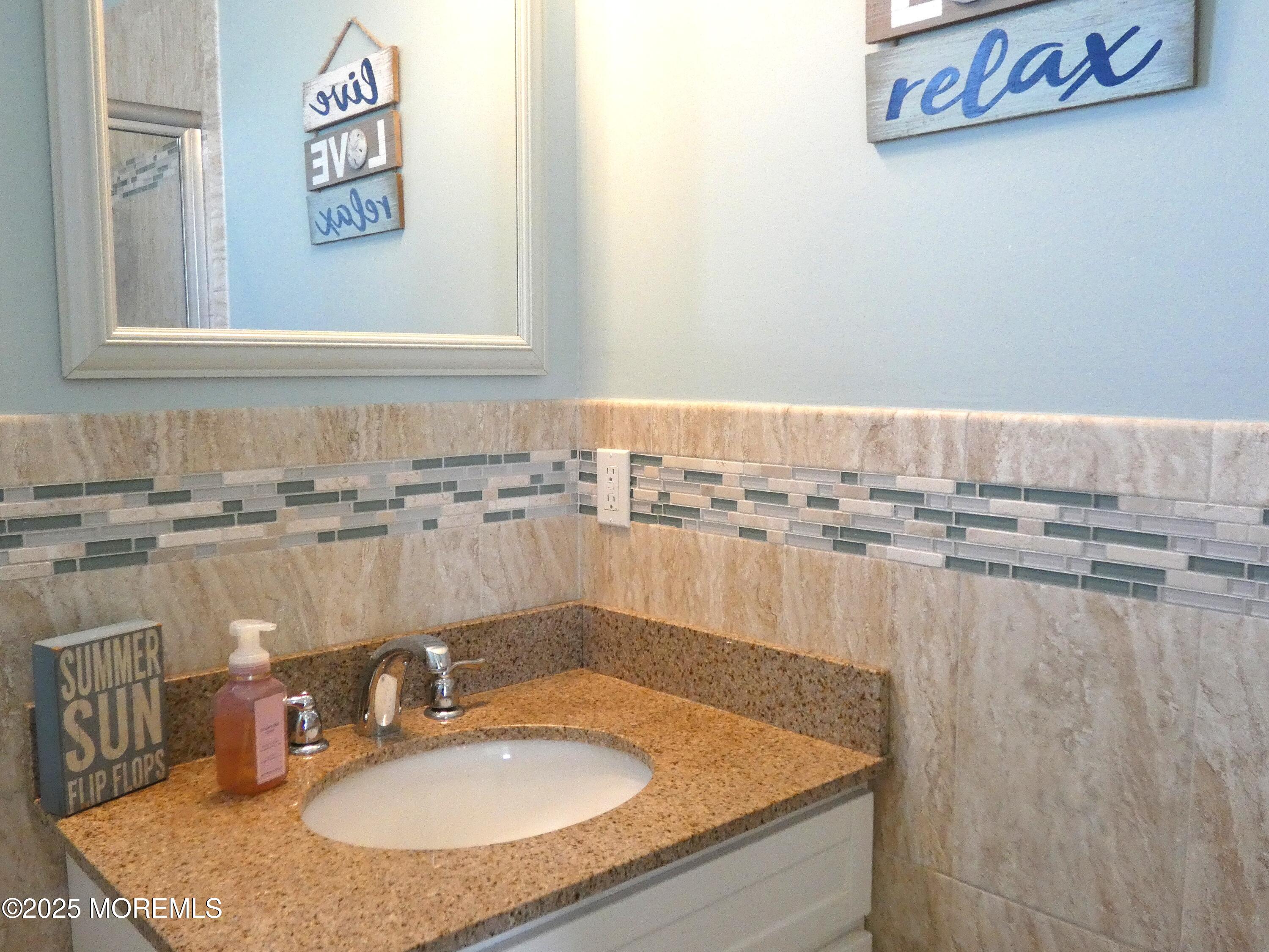 3311 Seaview Road Lavallette, NJ 08735 - Photo 20 of 27 a bathroom with a sink granite and a mirror
