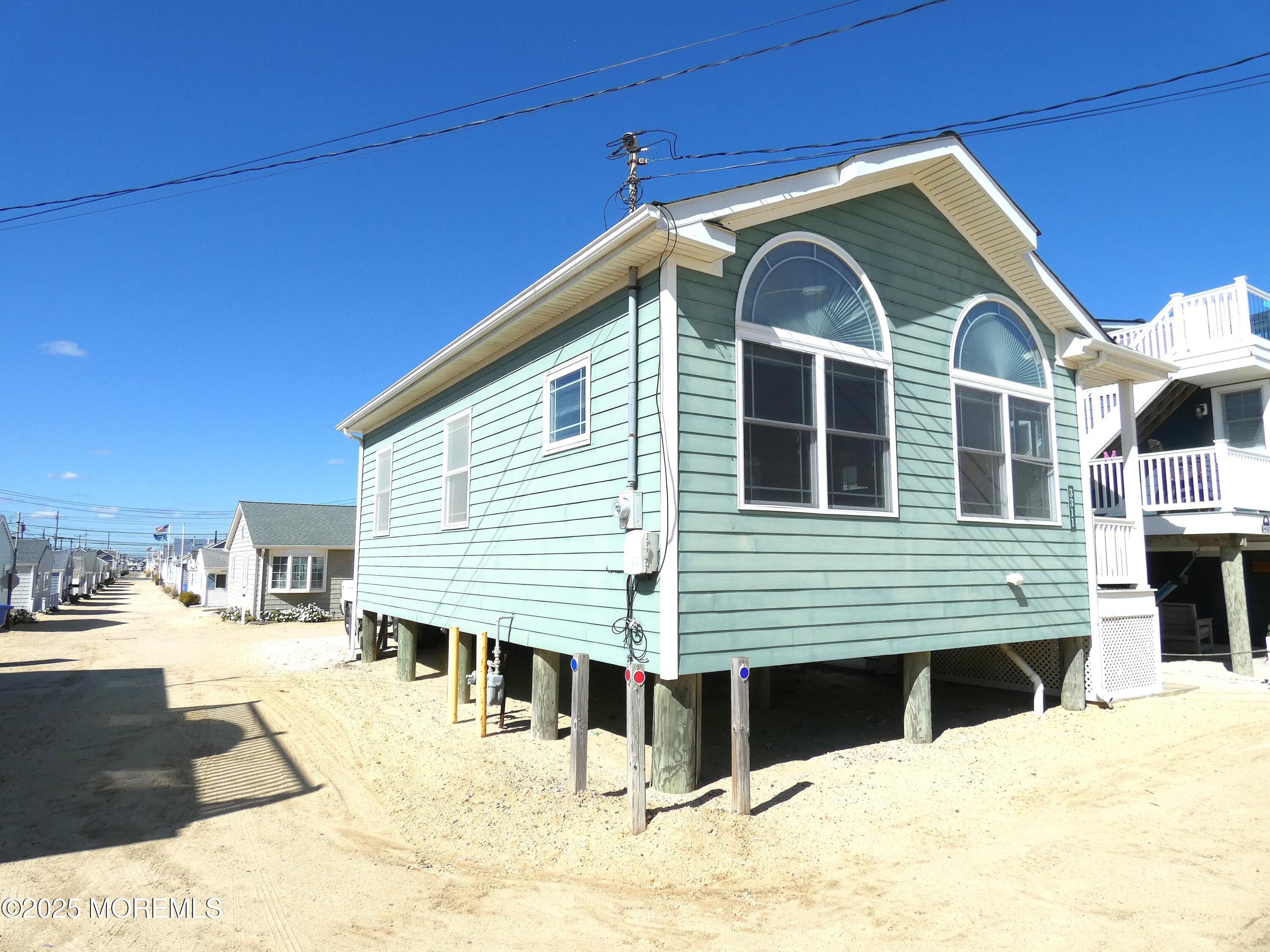 3311 Seaview Road Lavallette, NJ 08735 - Photo 2 of 27 a view of a house with a yard