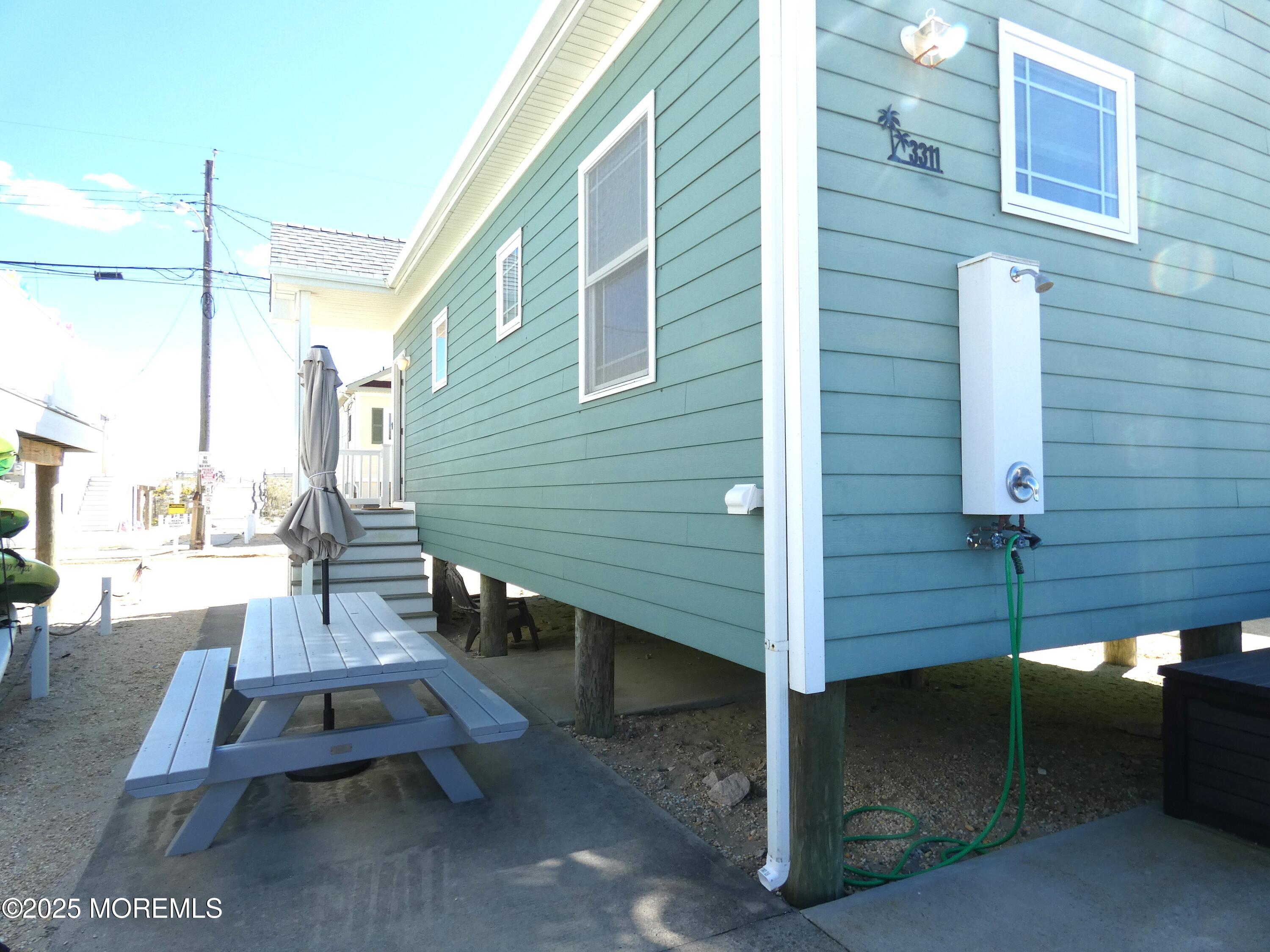 3311 Seaview Road Lavallette, NJ 08735 - Photo 23 of 27 a backyard of a house with outdoor seating