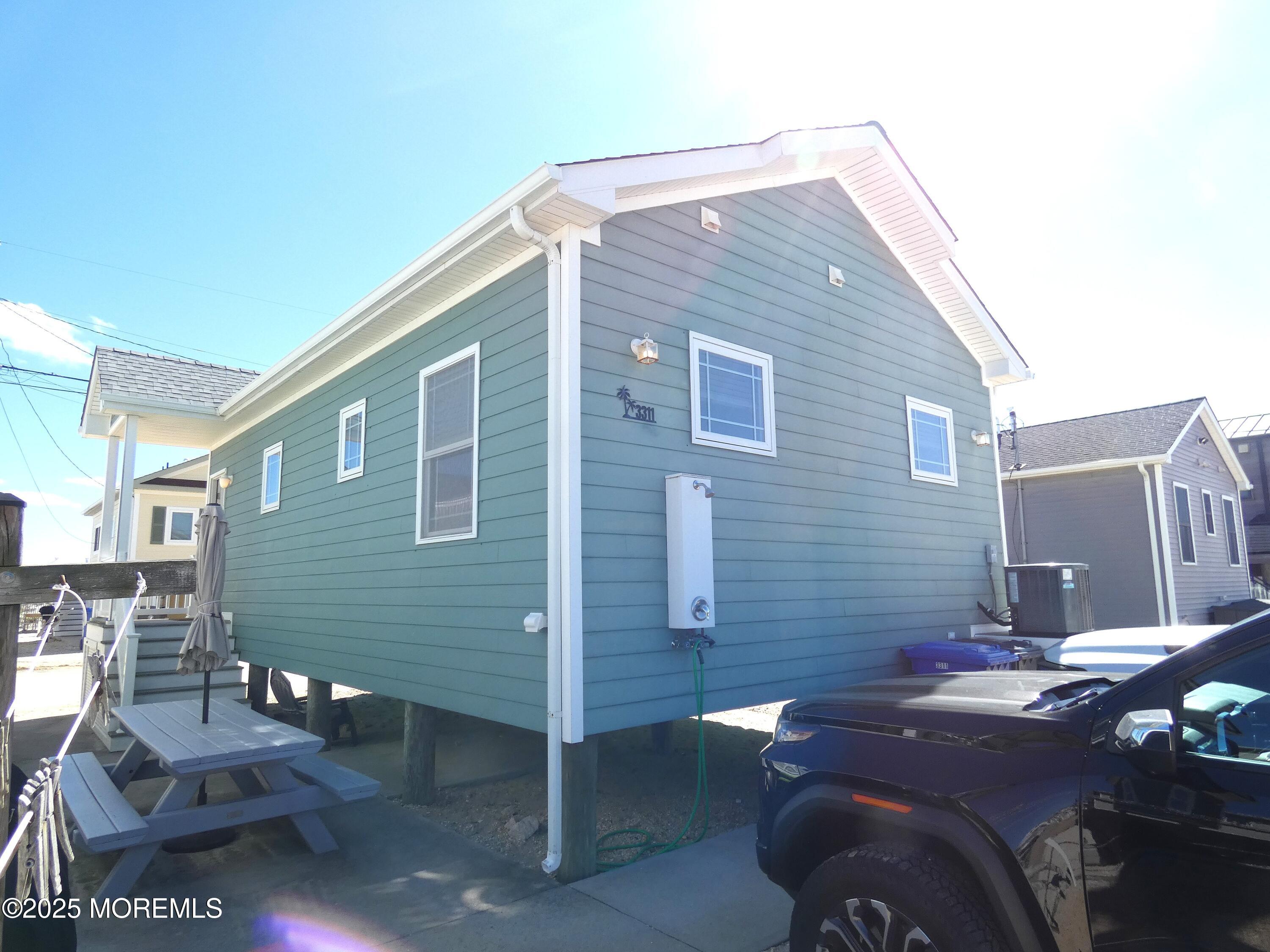 3311 Seaview Road Lavallette, NJ 08735 - Photo 25 of 27 a front view of a house with parking