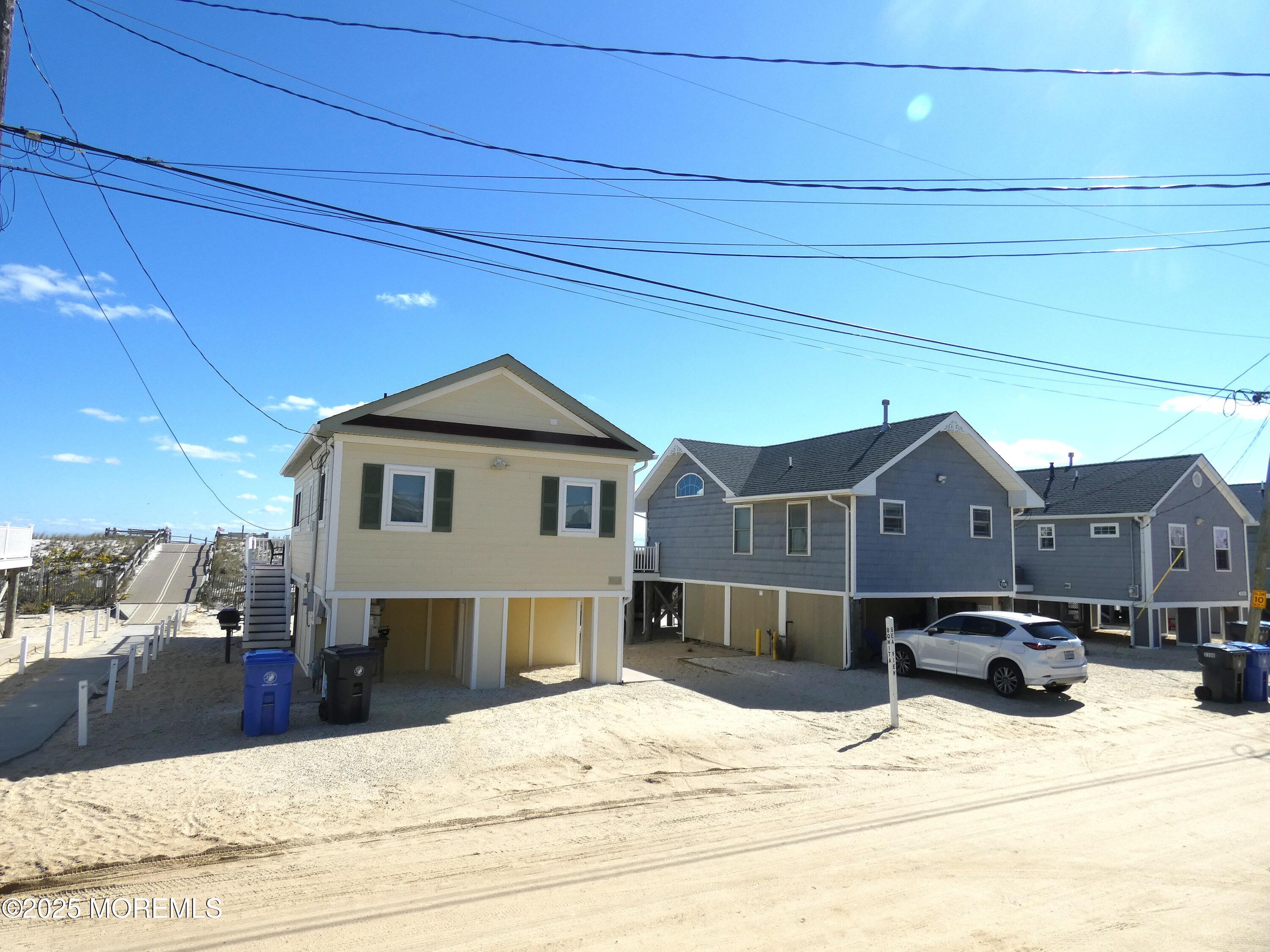 3311 Seaview Road Lavallette, NJ 08735 - Photo 27 of 27 a view of a house with a yard covered in snow