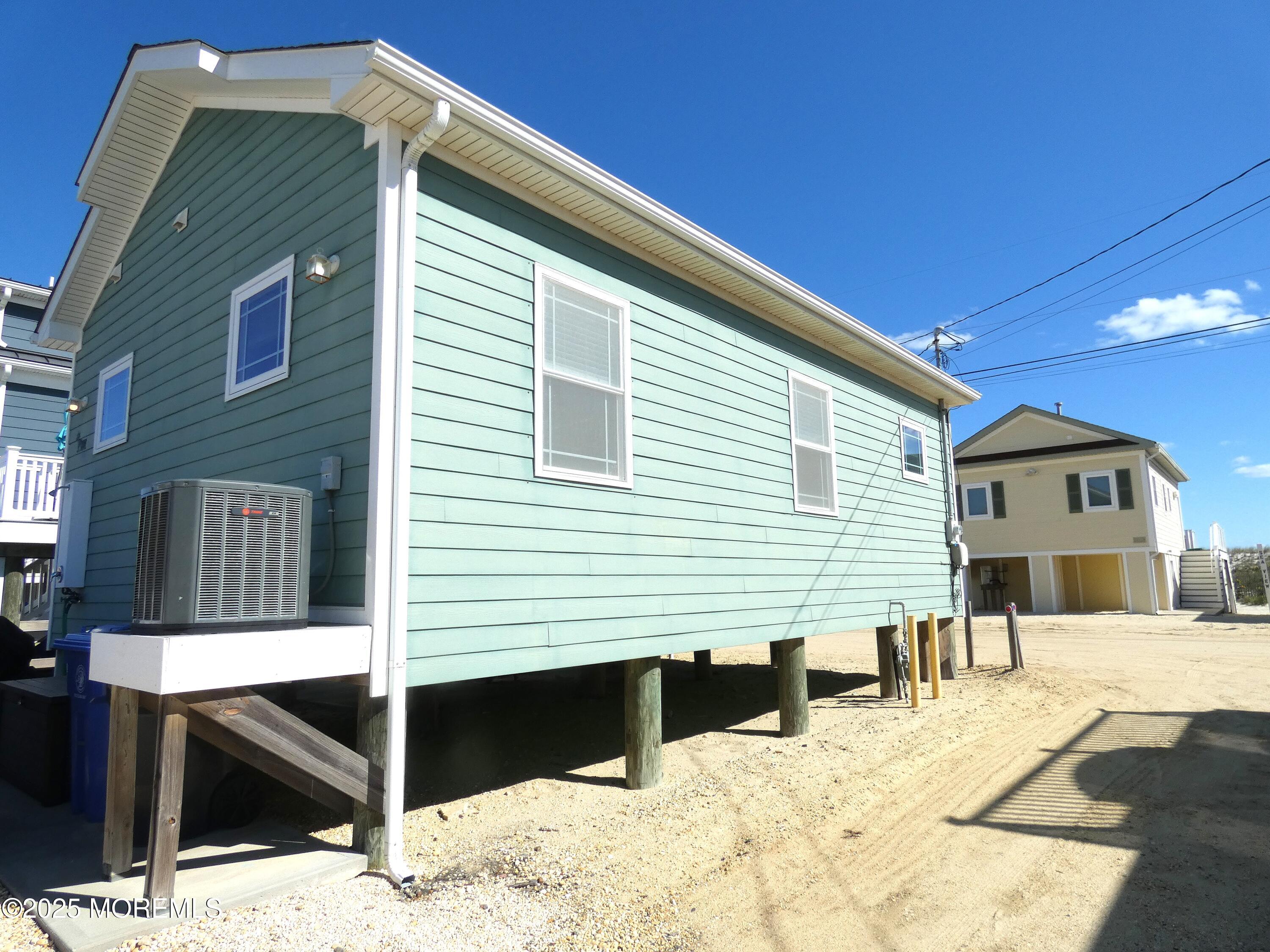 3311 Seaview Road Lavallette, NJ 08735 - Photo 3 of 27 a view of a house with a yard