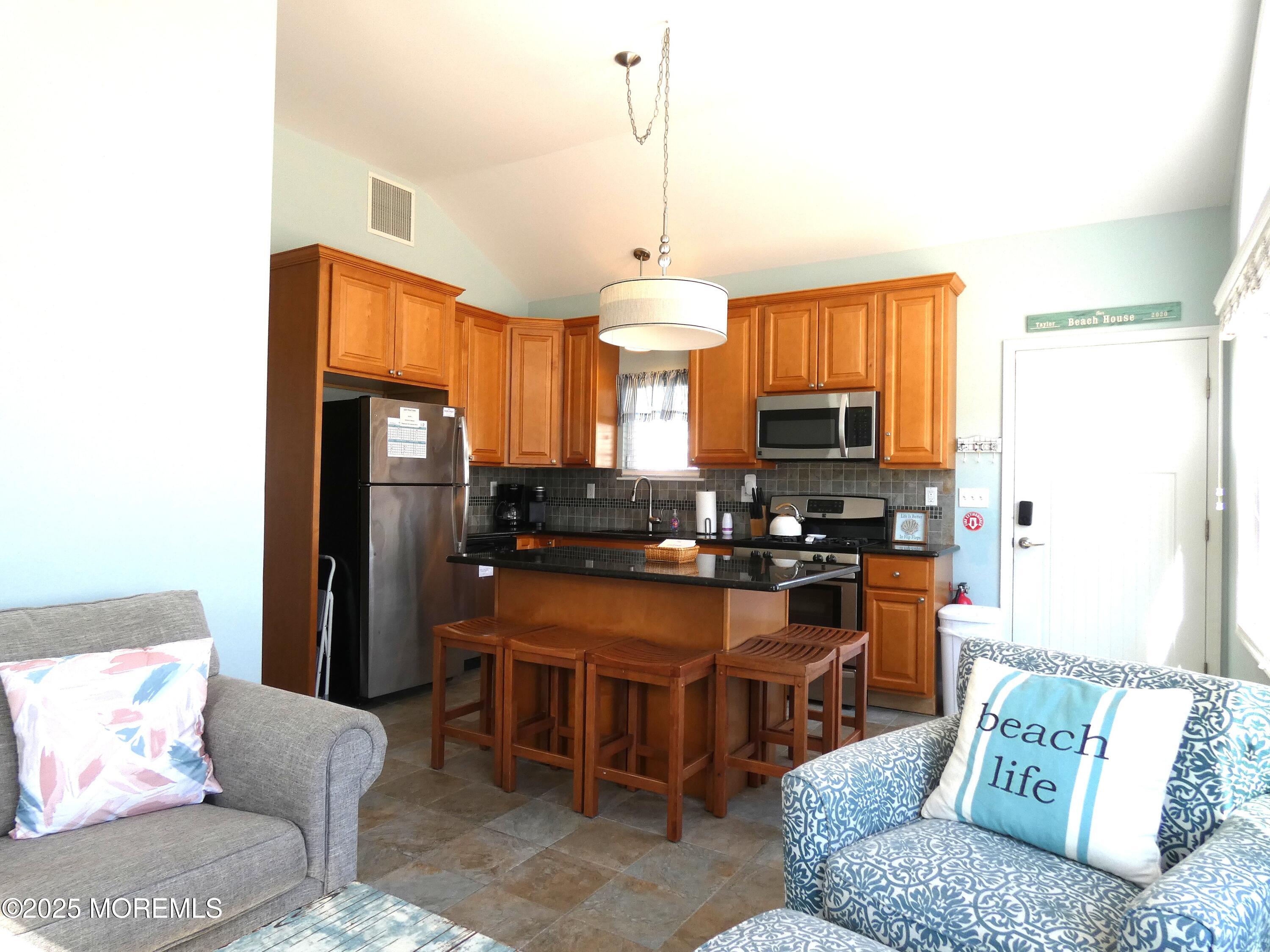 3311 Seaview Road Lavallette, NJ 08735 - Photo 8 of 27 a large kitchen with a large counter top appliances and cabinets
