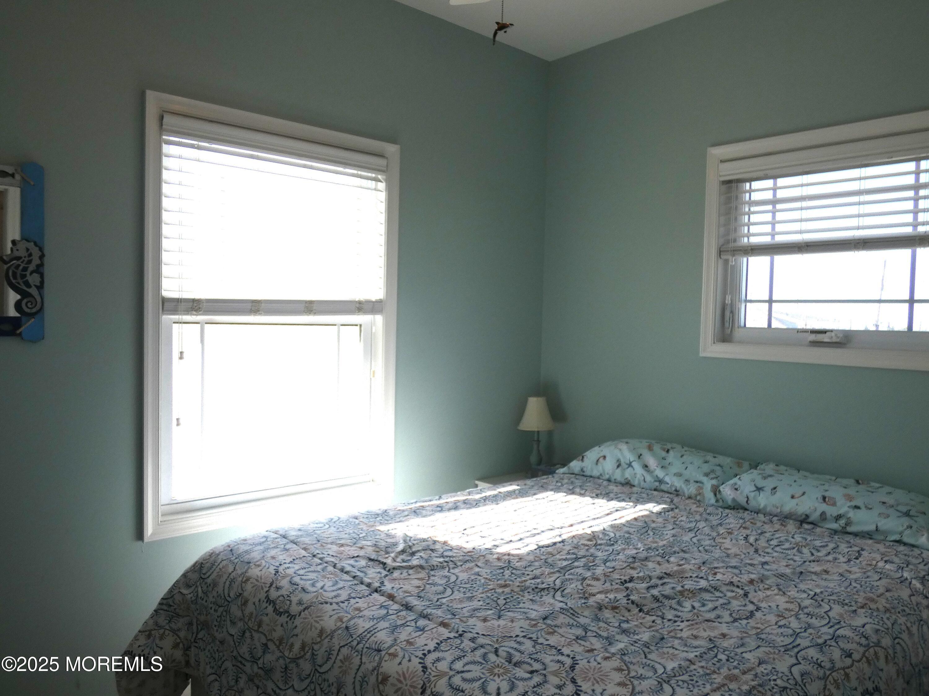 3311 Seaview Road Lavallette, NJ 08735 - Photo 10 of 27 a bedroom with a bed window and a closet