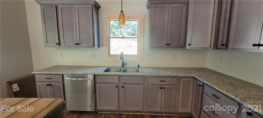 6722 Old Clyde Road Canton, NC 28716 - Photo 11 of 27 a kitchen with a sink cabinets and window