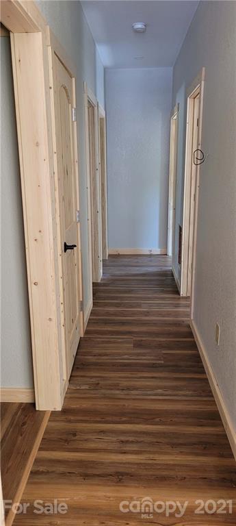6722 Old Clyde Road Canton, NC 28716 - Photo 17 of 27 a view of a hallway with wooden floor and staircase