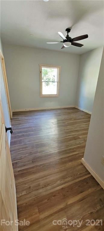 6722 Old Clyde Road Canton, NC 28716 - Photo 18 of 27 a view of a room with wooden floor and white walls