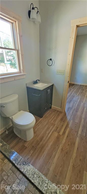 6722 Old Clyde Road Canton, NC 28716 - Photo 21 of 27 a bathroom with a toilet a sink and a window