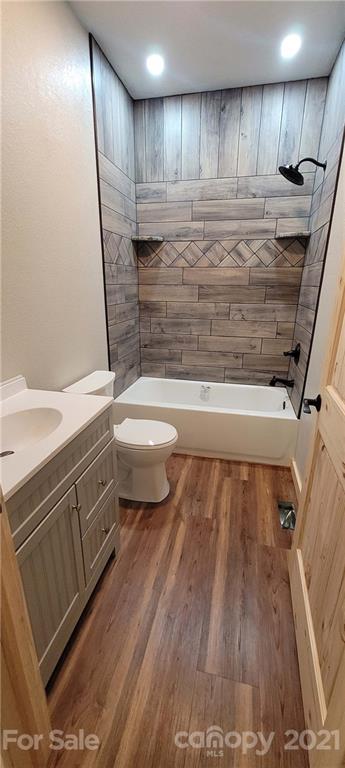 6722 Old Clyde Road Canton, NC 28716 - Photo 23 of 27 a view of water heater room with wooden floor and staircase