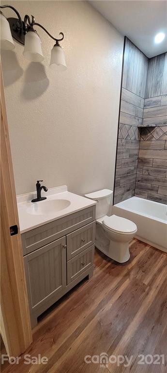 6722 Old Clyde Road Canton, NC 28716 - Photo 24 of 27 a bathroom with a sink a toilet and bathtub