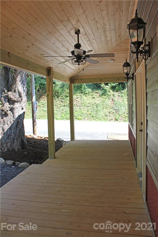 6722 Old Clyde Road Canton, NC 28716 - Photo 3 of 27 a view of a floor to ceiling window and a ceiling fan