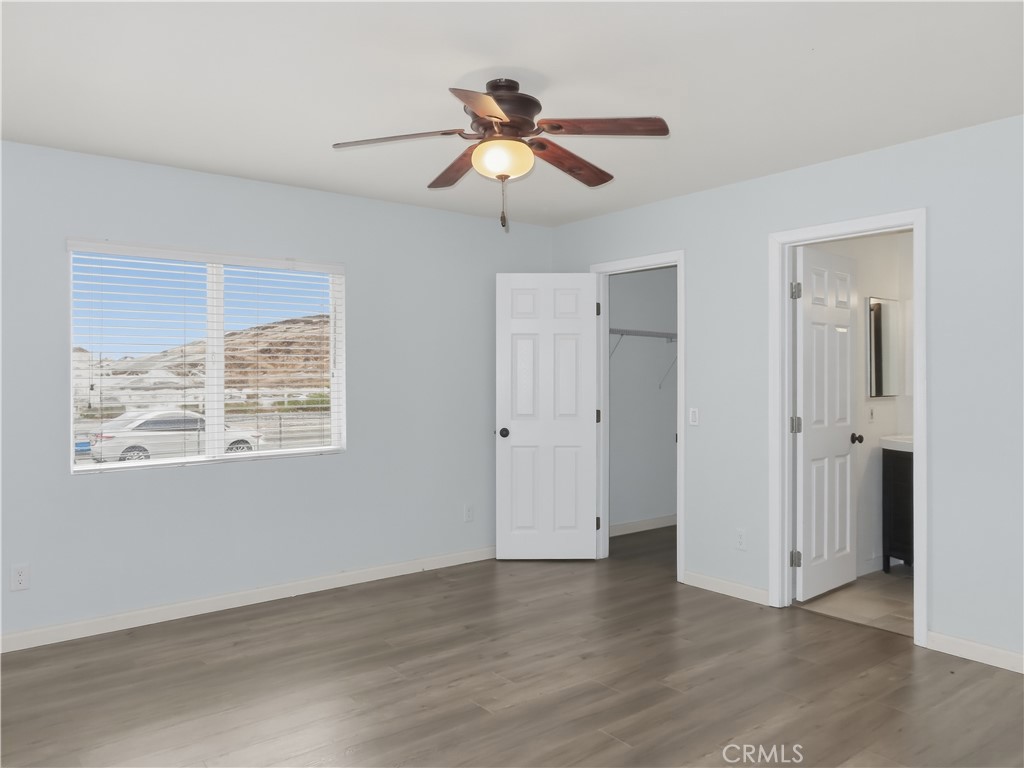 4409 Challen Avenue Riverside, CA 92503 - Photo 14 of 31 a view of an empty room with wooden floor and a window