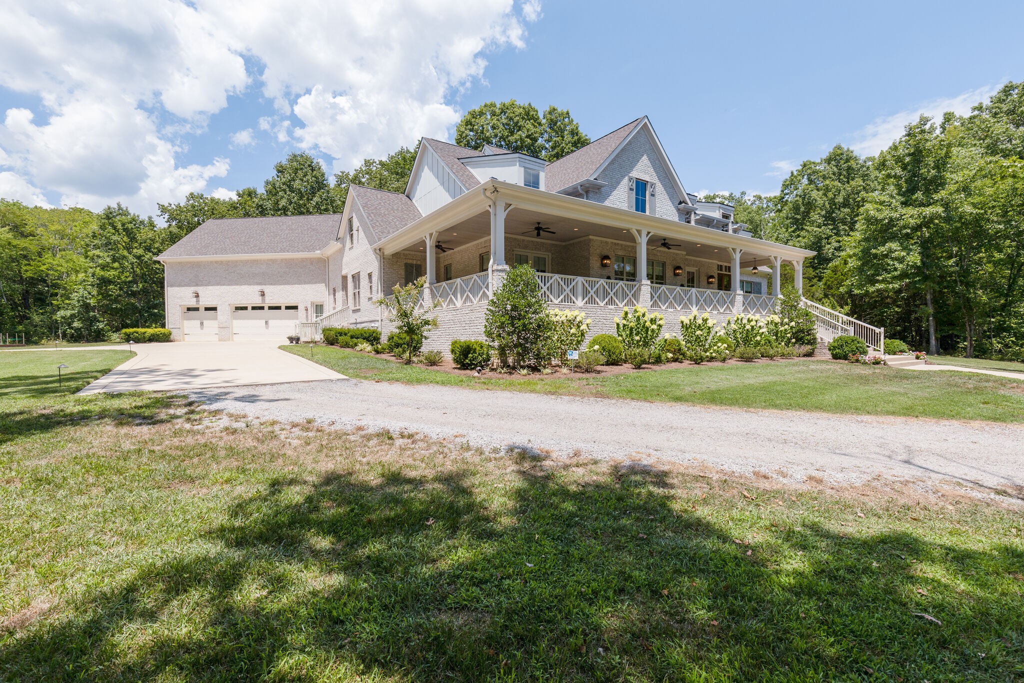 4841 Ollie Chunn Road Spring Hill, TN 37174 - Photo 3 of 69 a front view of a house with a yard and potted plants