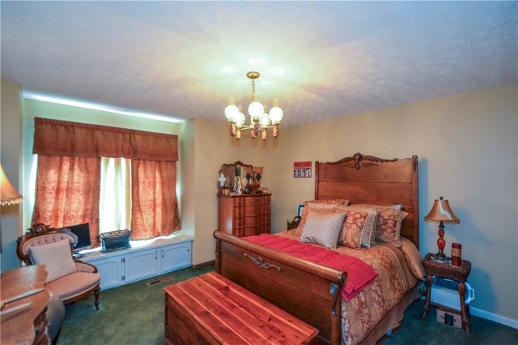 130 Hawn Road Fayetteville, GA 30215 - Photo 24 of 67 a bedroom with bed and window