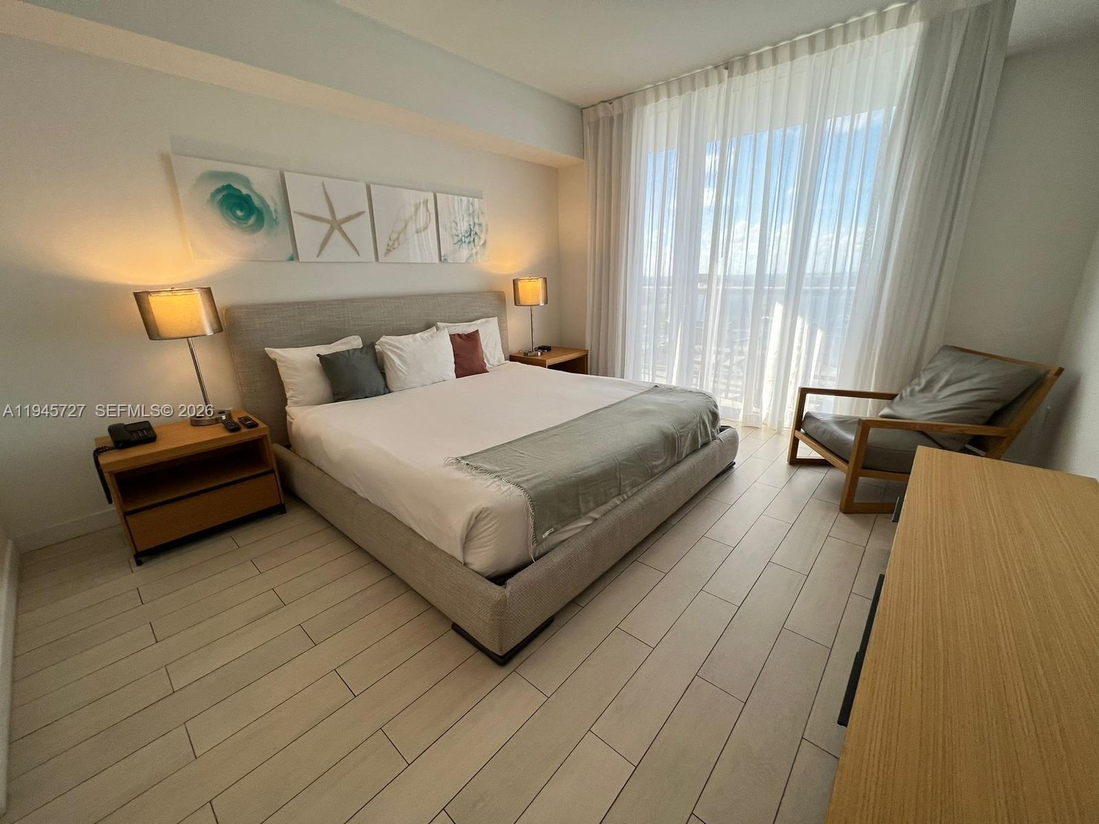 2602 East Hallandale Beach Boulevard, Unit R2810 Hallandale Beach, FL 33009 - Photo 12 of 31 a spacious bedroom with a bed and window