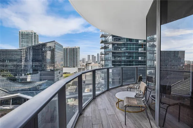 a balcony with view of outdoor space