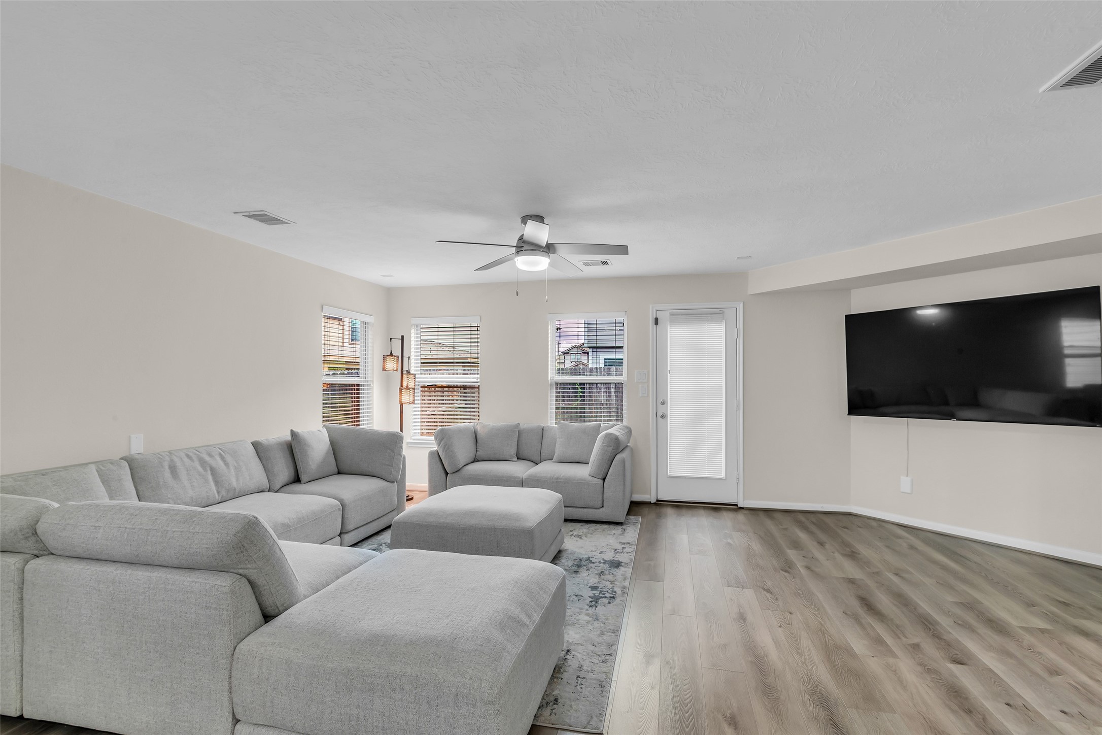 12626 Mint Field Houston, TX 77066 - Photo 11 of 26 a living room with furniture and a flat screen tv