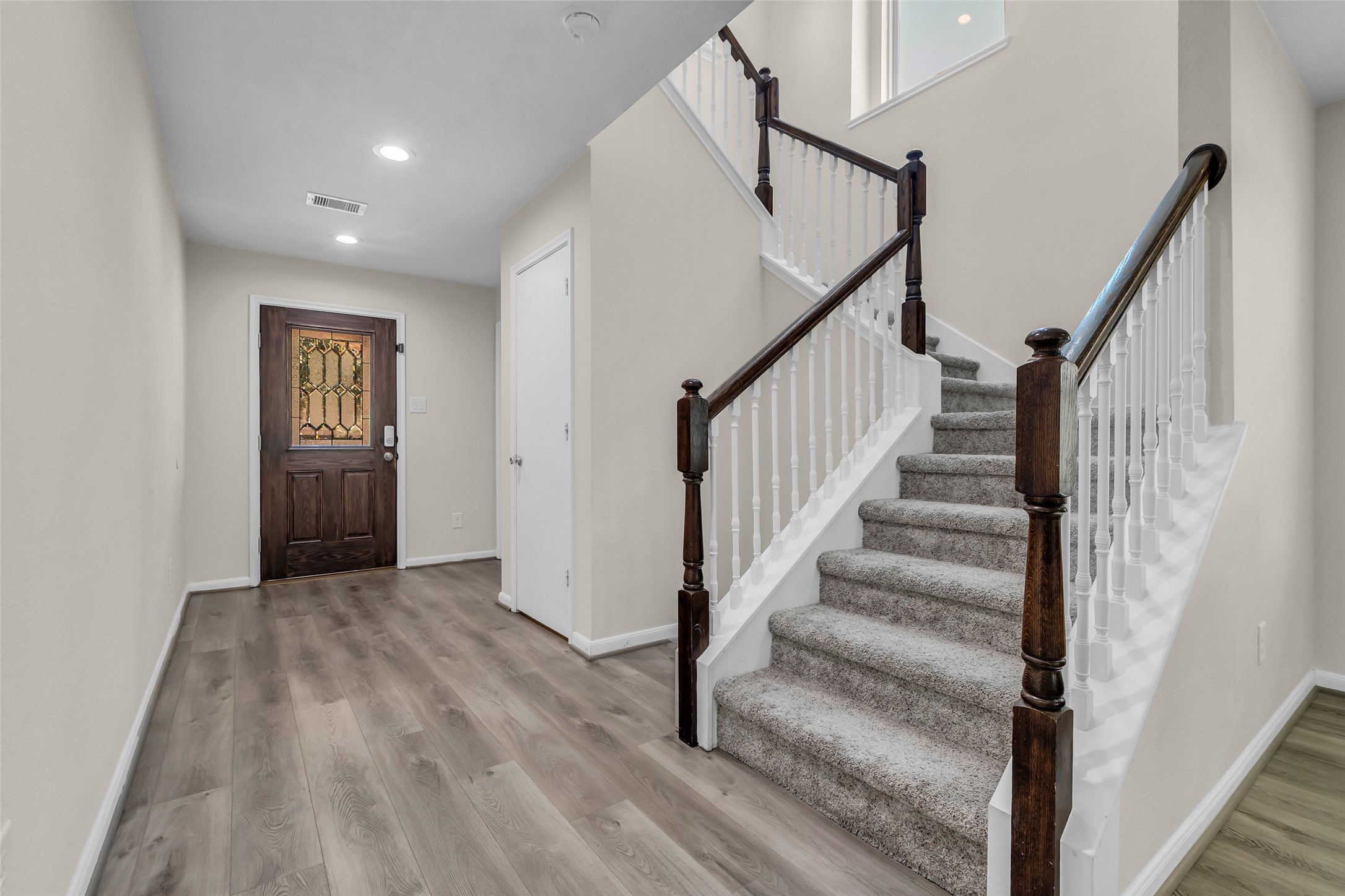 12626 Mint Field Houston, TX 77066 - Photo 17 of 26 a view of an entryway with wooden floor and stairs