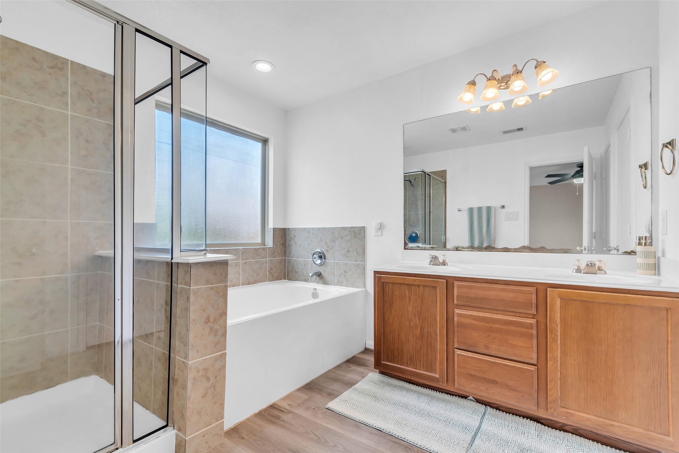 12626 Mint Field Houston, TX 77066 - Photo 20 of 26 a spacious bathroom with a tub sink and mirror