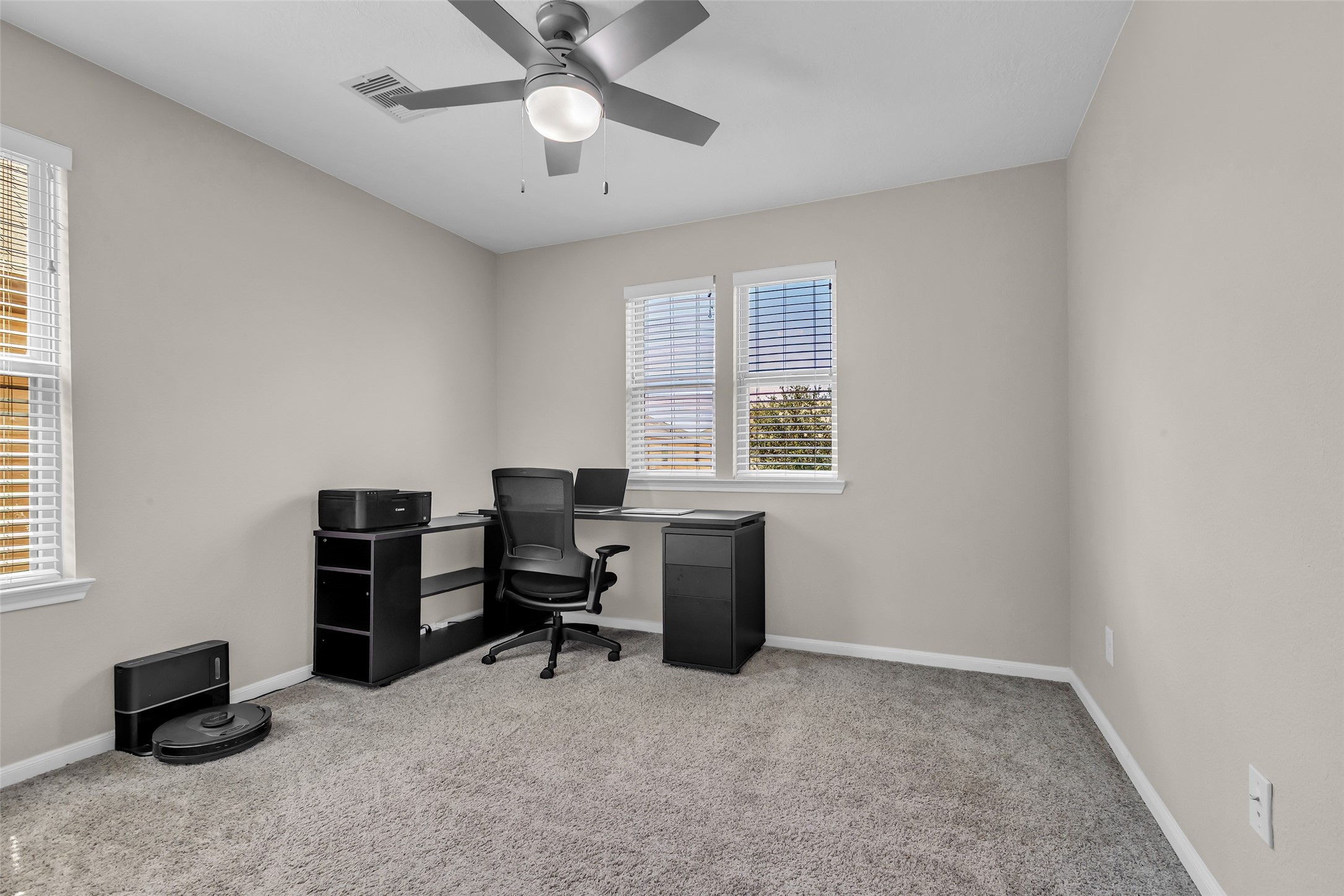 12626 Mint Field Houston, TX 77066 - Photo 21 of 26 a view of a workspace with furniture and a window