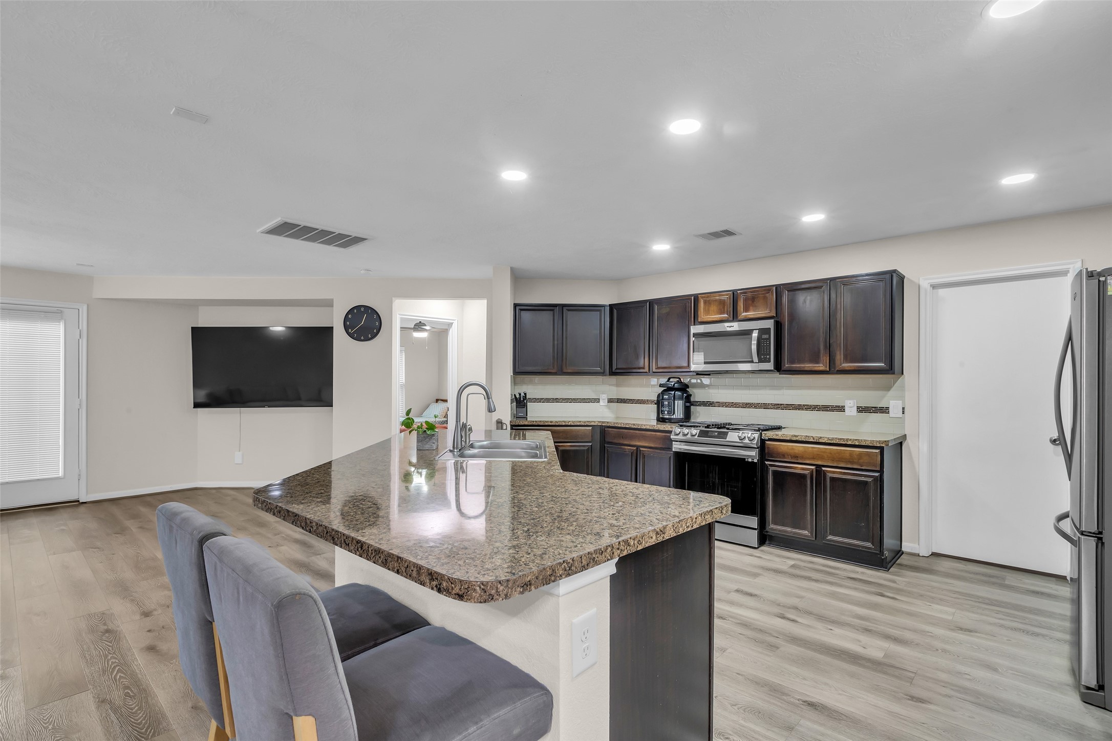 12626 Mint Field Houston, TX 77066 - Photo 5 of 26 a kitchen with stainless steel appliances granite countertop a sink counter space and cabinets