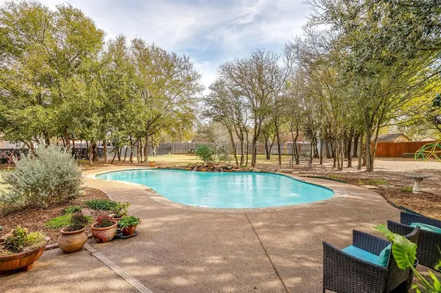 a view of outdoor space with lots of trees