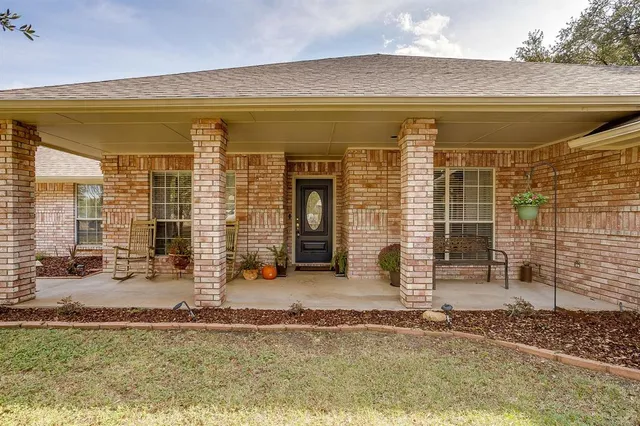 a view of a brick house with outdoor space