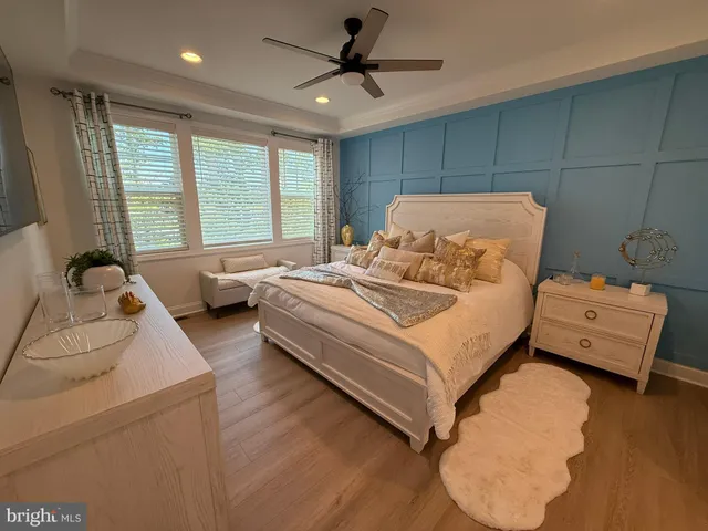 a bed room with a bed and a chair