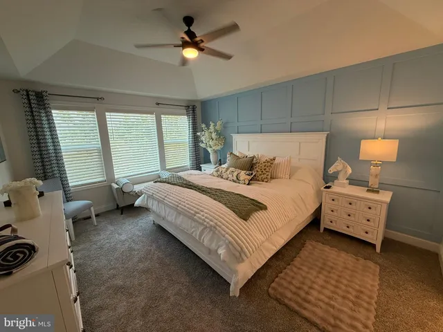 a bed room with a bed and a tv