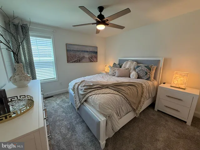 a bedroom with bed and a window