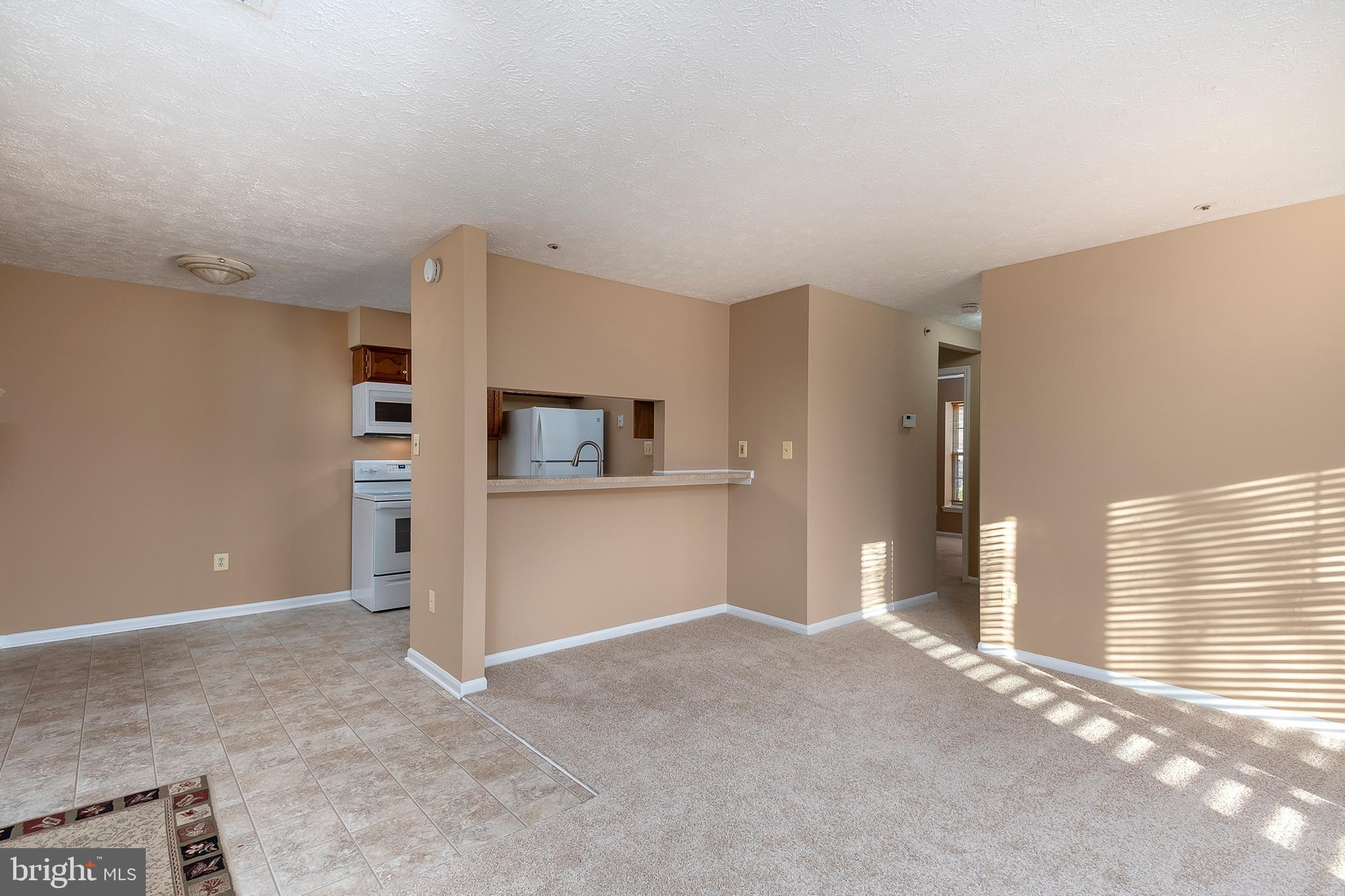 6435 Greenfield Road, Unit 1201 Elkridge, MD 21075 - Photo 5 of 19 Living Room to Kitchen