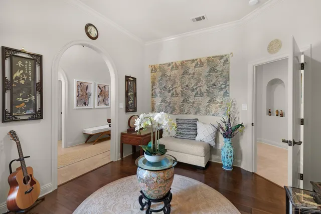 a living room with furniture couches and a table