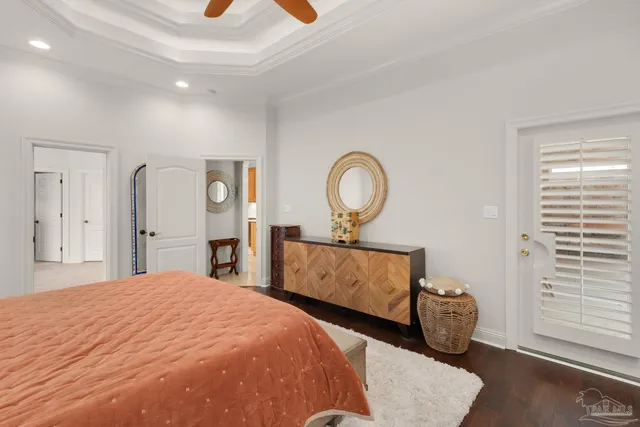 a bedroom with bed and a chandelier