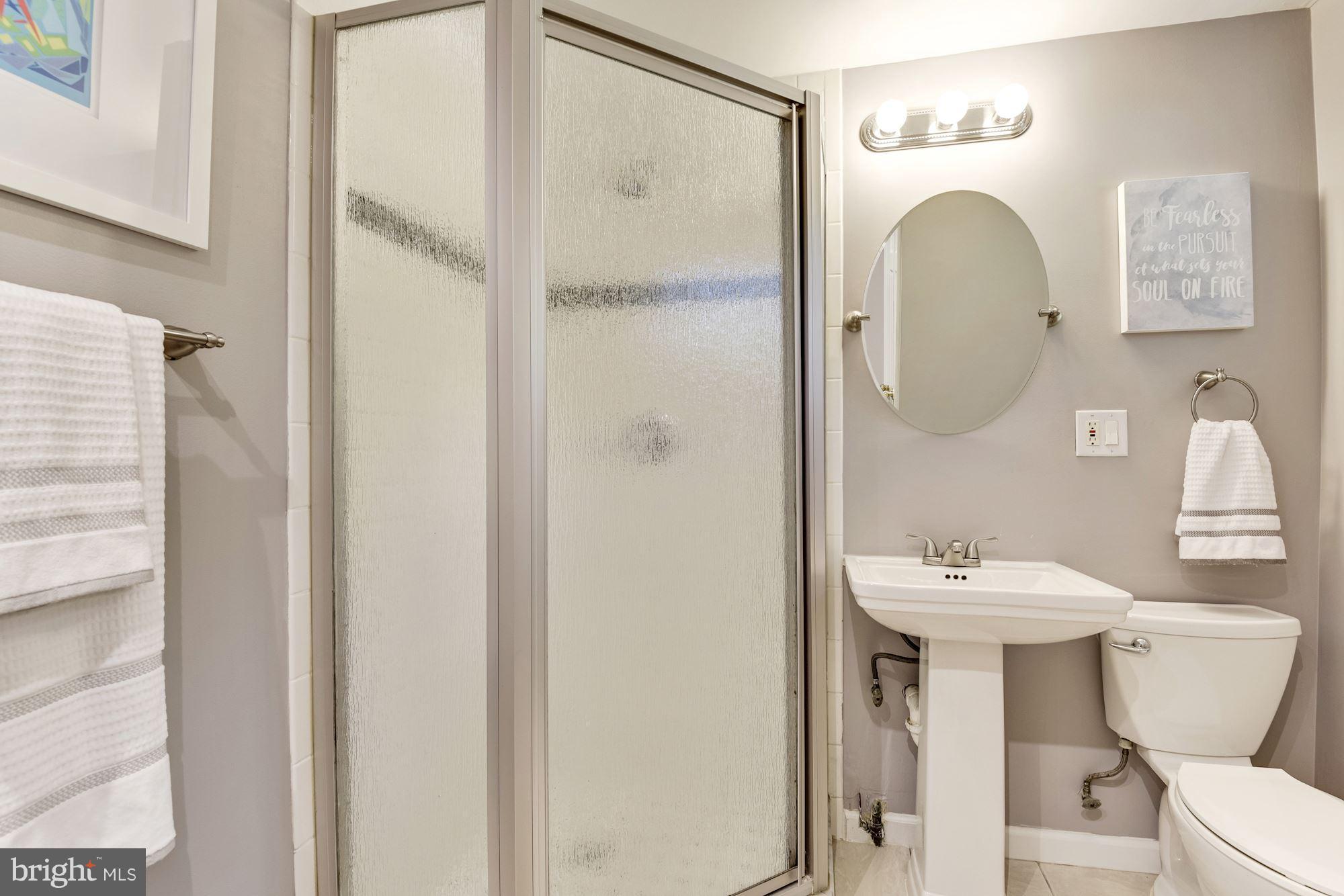1659 Preston Road Alexandria, VA 22302 - Photo 16 of 26 a bathroom with a sink mirror and toilet