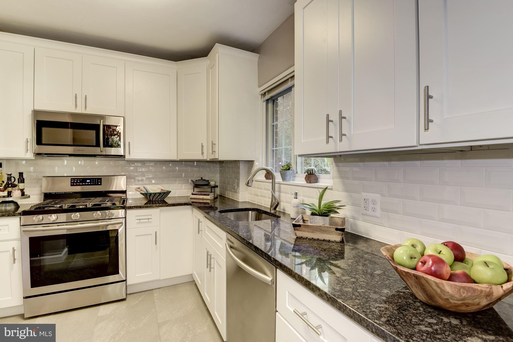 1659 Preston Road Alexandria, VA 22302 - Photo 10 of 26 a kitchen with granite countertop cabinets stainless steel appliances and a sink
