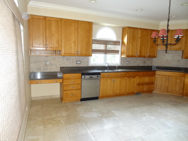 8 Ridge Road Highland Park, IL 60035 - Photo 2 of 20 a kitchen with a stove a sink and a refrigerator