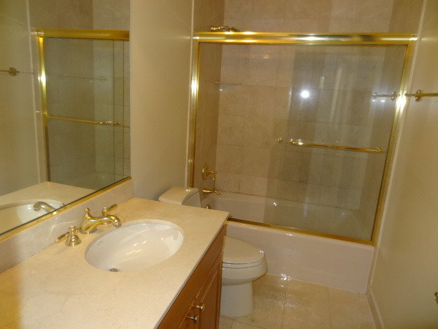 8 Ridge Road Highland Park, IL 60035 - Photo 14 of 20 a bathroom with a sink and mirror