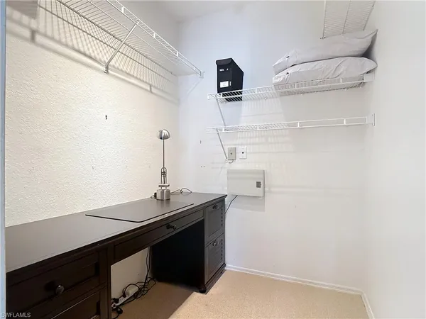 a bathroom with a toilet a sink and a mirror