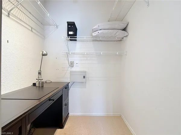 a bathroom with a granite countertop toilet a sink and a shower