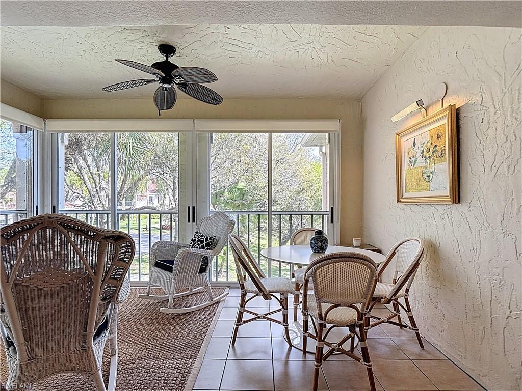 106 Siena Way, Unit 1508 Naples, FL 34119 - Photo 39 of 47 a living room with furniture ceiling fan and a window